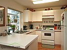Property Image 983Upstairs rambler kitchen with garden window